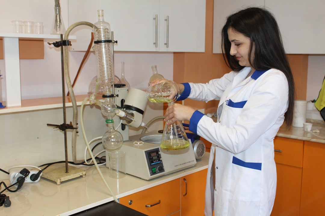 Lab chemist working with boronate intermediates